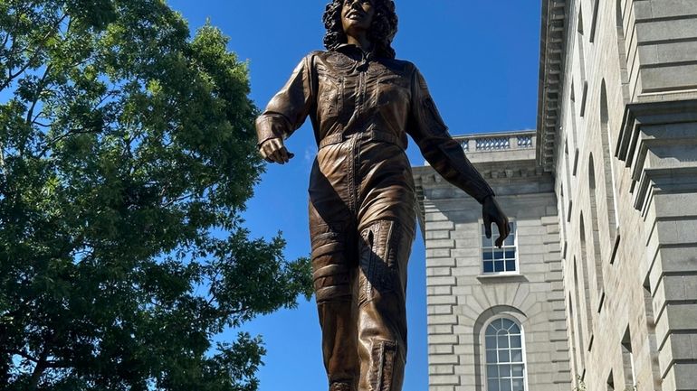 A statue of America's first teacher in space, Christa McAuliffe,...