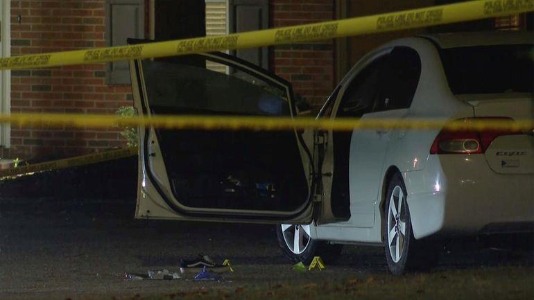 Law enforcement officers work a crime scene in the Hedingham...