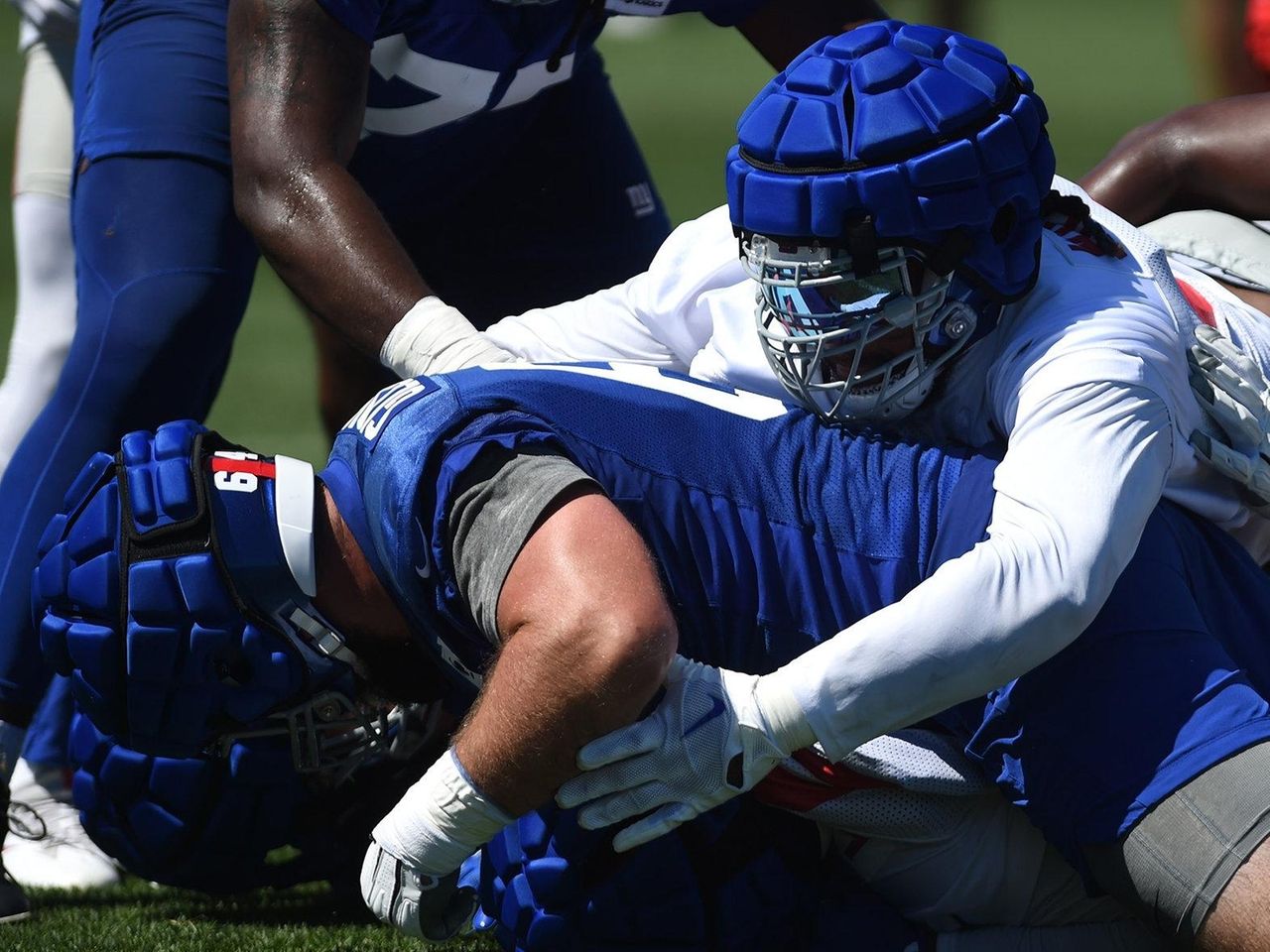 What are those funny-looking soft caps on NFL helmets during camp?, Sports