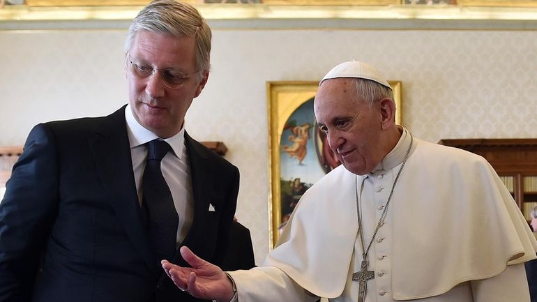 FILE -- Pope Francis, right, talks with Belgium's King Philippe...