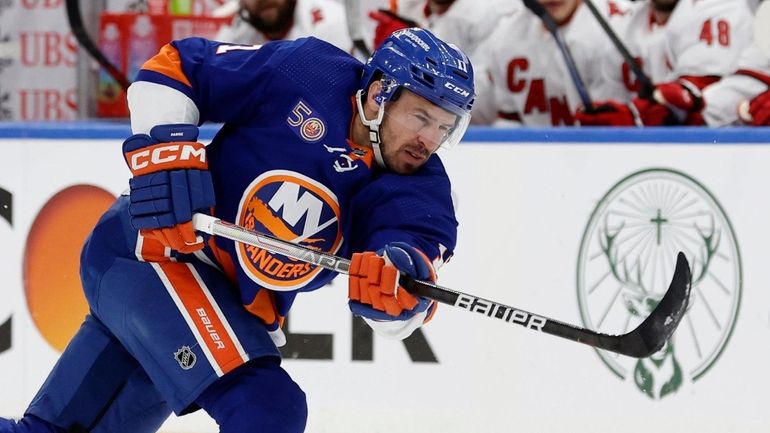 Zach Parise of the Islanders shoots the puck during the first period...