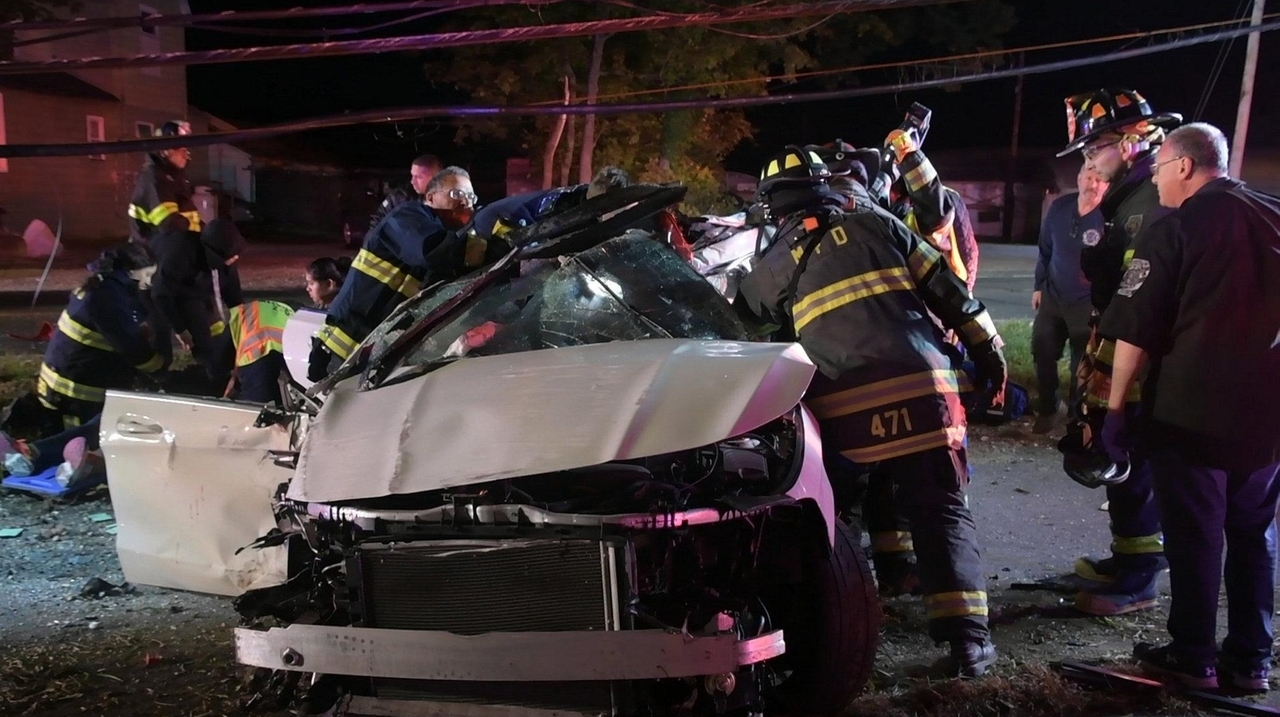 Two hurt when car hits poles, overturns in Melville, police say Newsday