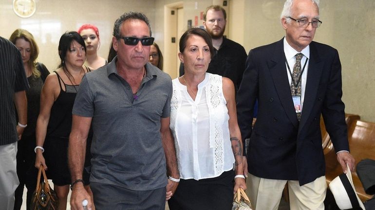 Philip and Cathy Vetrano, center, parents of slain Howard Beach...