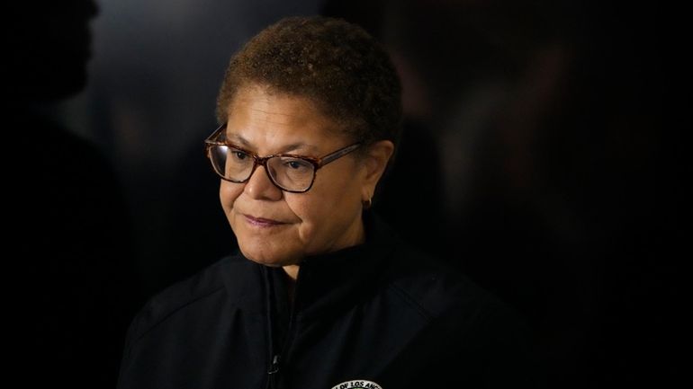 Los Angeles Mayor Karen Bass waits to speak during a...