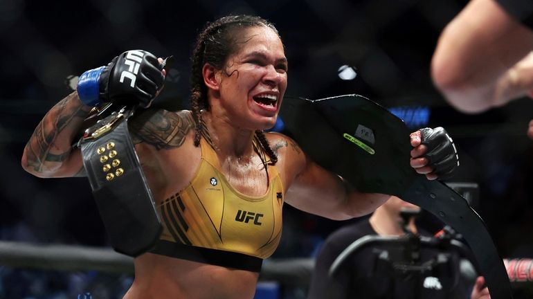 Amanda Nunes reacts after defeating Julianna Pena in a mixed...