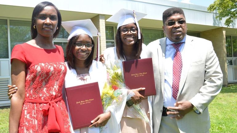 North Shore High School students Nicole and Neila Cruz, center,...