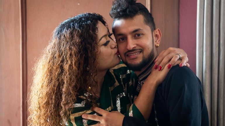 FILE- Same-sex couple Surendra Pandey, right, and Maya Gurung, who...