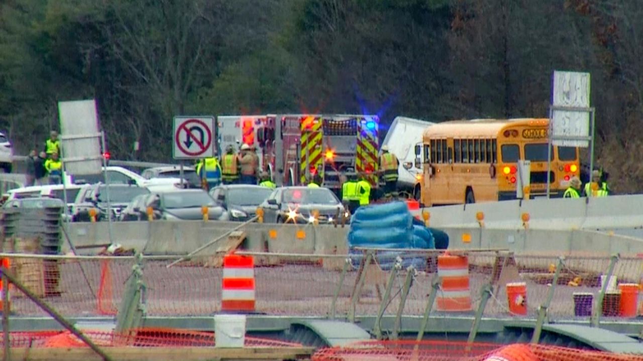 Bus rollover crash on upstate New York highway leaves 1 dead and a