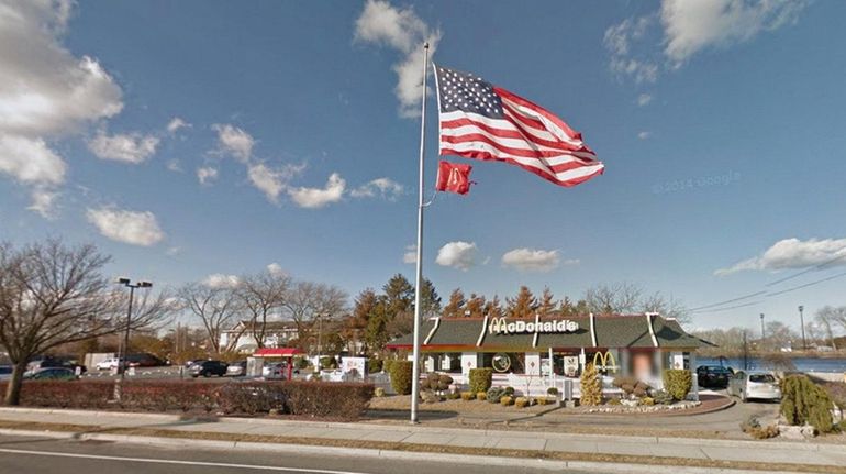 A photo of an upside-down flag flying at the McDonald's...