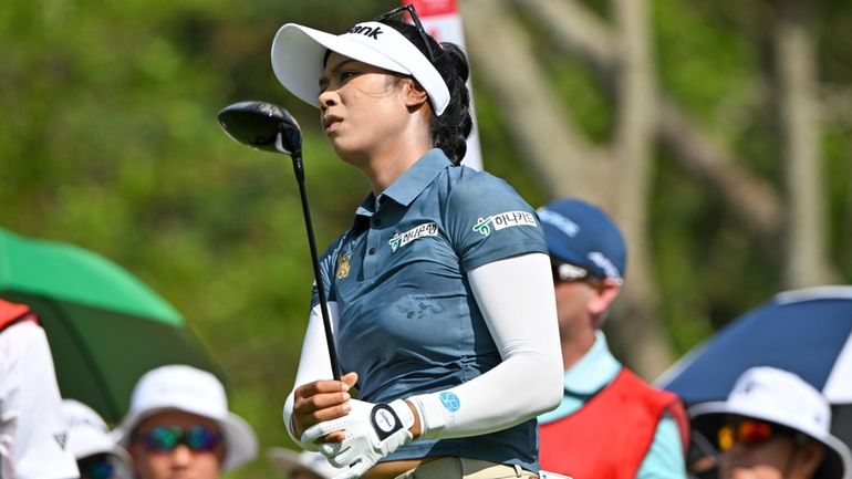 Patty Tavatanakit of Thailand watches her shot on the second...