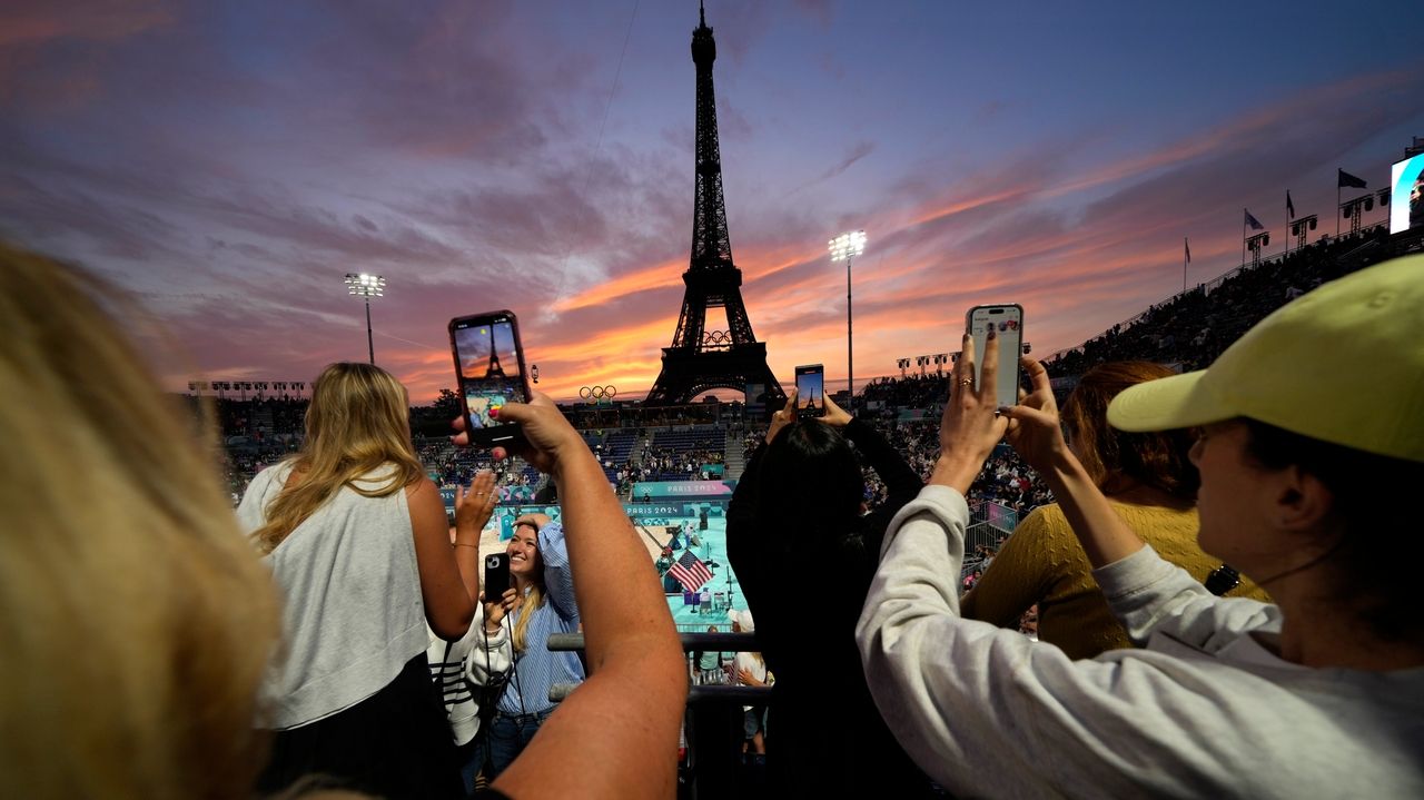 Beach volleyball at Eiffel Tower stadium draws the crowds looking for