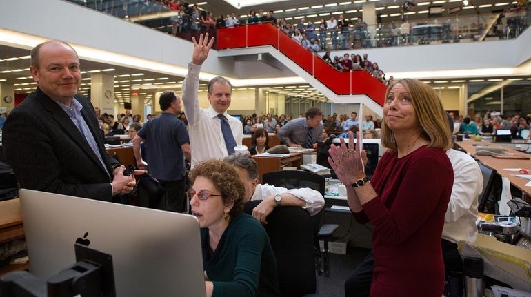 New York Times executive editor Jill Abramson, right, celebrates the...