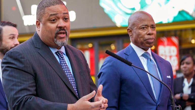 FILE — Manhattan District Attorney Alvin Bragg, left, and New...