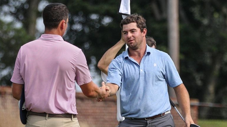 Chris DeForest, left, congratulates Cameron Young on his victory at...