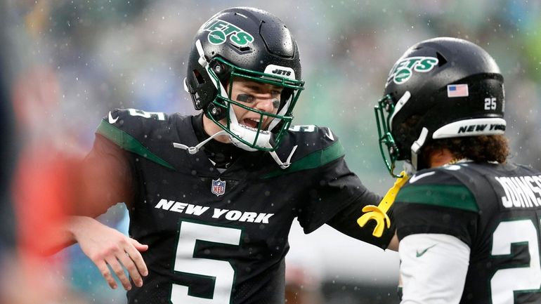 Mike White #5 of the New York Jets celebrates with...