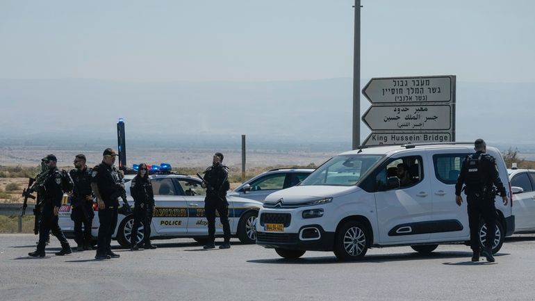 Israeli police stand guard near the site of a deadly...