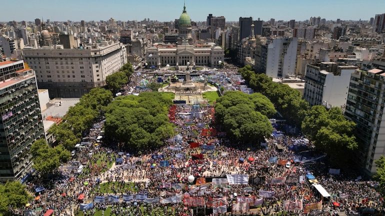 People rally outside Congress during a national strike against the...