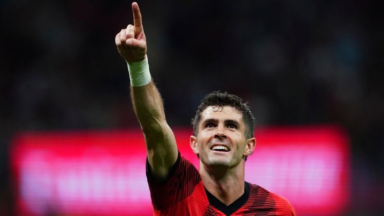 AC Milan's Christian Pulisic celebrates after scoring his side's second...