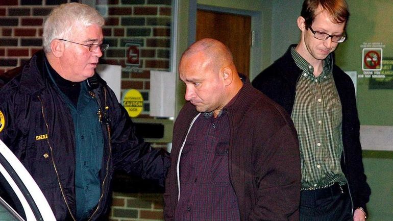 Craighead County Chief Deputy Bob Sharp escorts Jessie Lloyd Misskelley,...