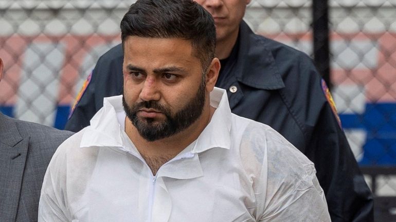 Amandeep Singh of Roslyn leaves Nassau Police Headquarters in Mineola on...