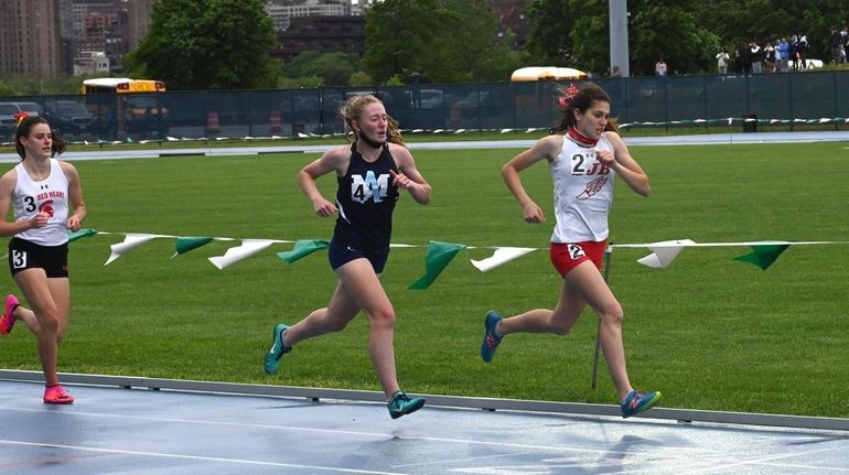 Sabrina Spezia from St. John the Baptist approaches the finish...