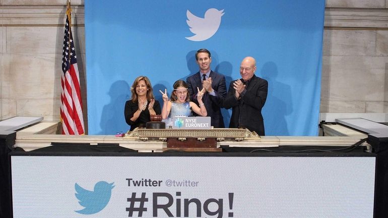 British actor Sir Patrick Stewart, right, helps ring the opening...