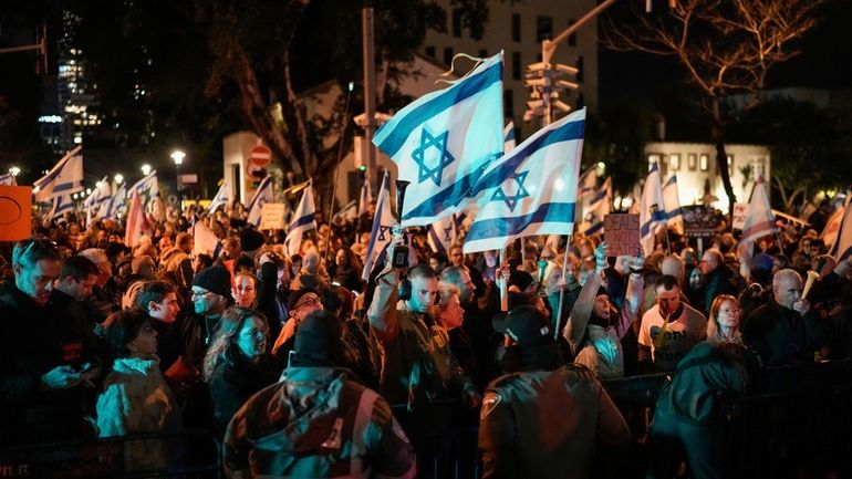 Demonstrators protest against Israeli Prime Minister Benjamin Netanyahu and call...