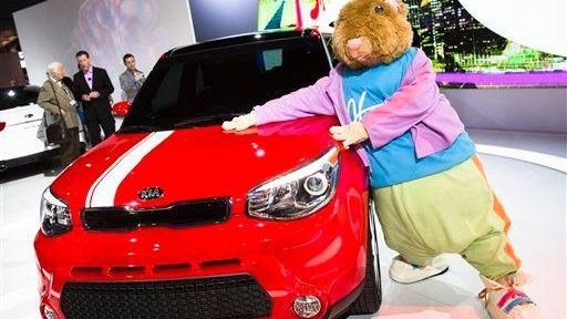 A Kia "Hamstar" mascot poses for a photograph with the...