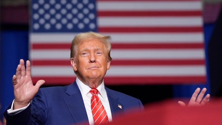 Republican presidential nominee former President Donald Trump arrives at a...