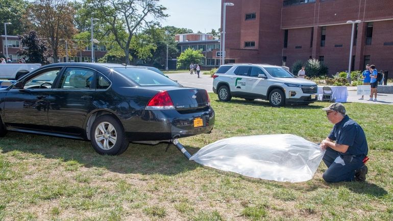 A demonstration shows emissions from an internal combustion engine at a...