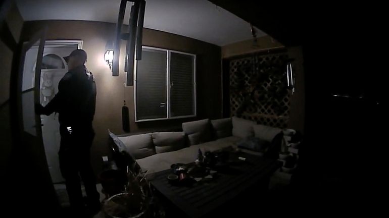 In this image taken from body camera video provided by...