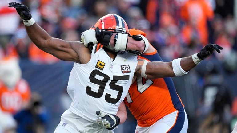 Cleveland Browns defensive end Myles Garrett (95) rushes the passer...