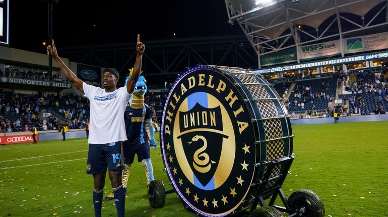 Philadelphia Union's Cory Burke reacts after hitting the drum following...