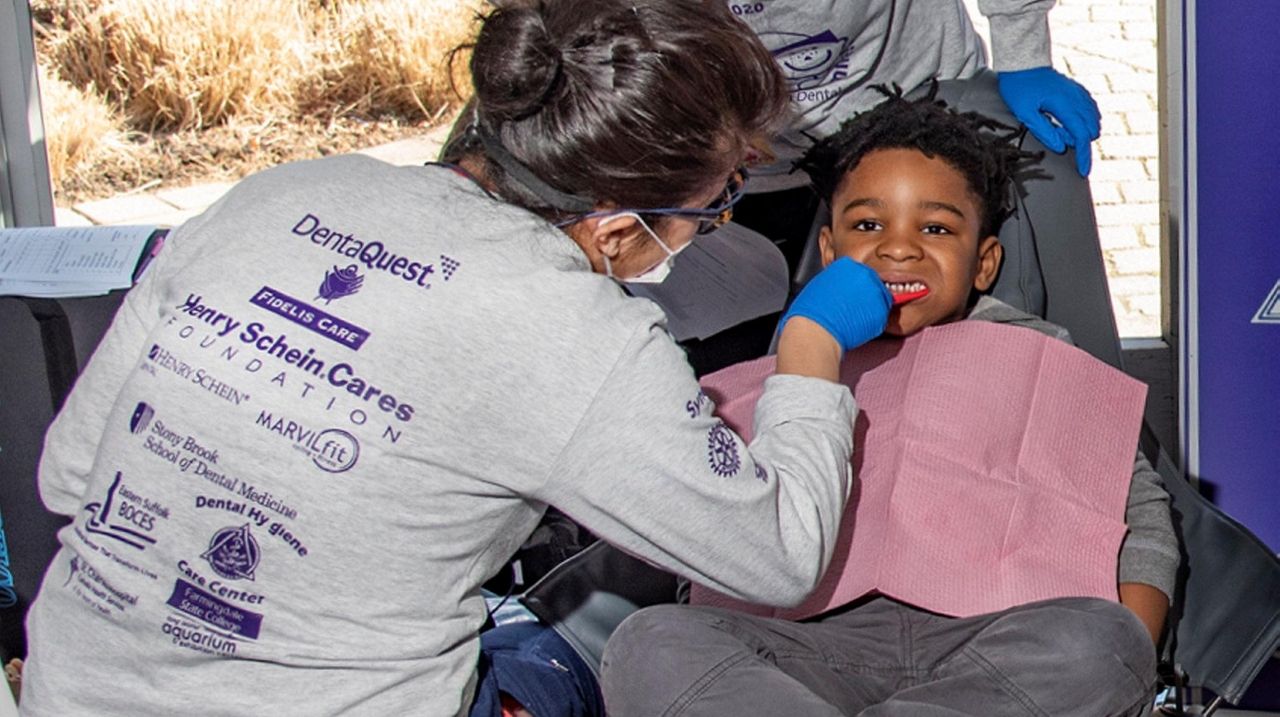 'Give kids a smile' Children get free dental care at aquarium in