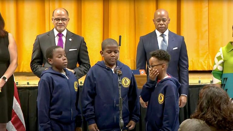 Third graders Shawn Boyce, Cach Grandison and Noah Hill (left...