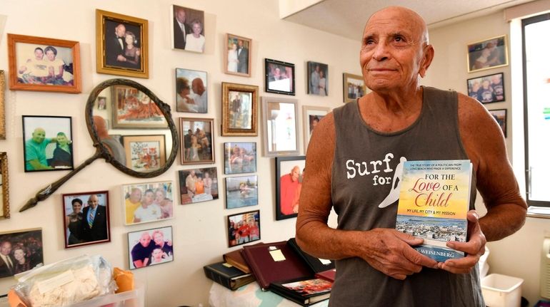 Harvey Weisenberg holds a copy of his autobiogrphy. It's the story...