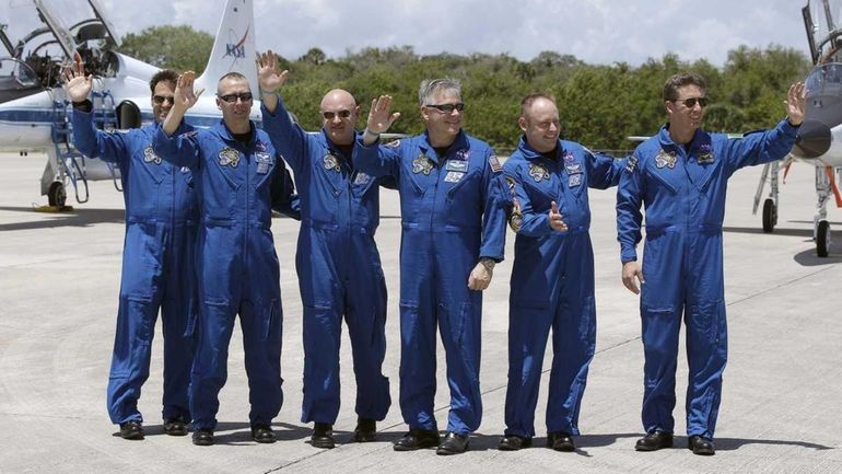 STS-134 crew members, from left, Mission Specialists Greg Chamitoff of...