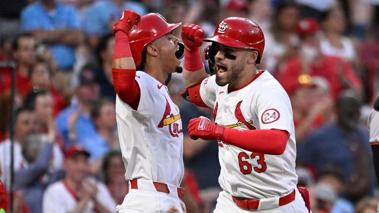 St. Louis Cardinals' Michael Siani (63), right, celebrates with teammate...