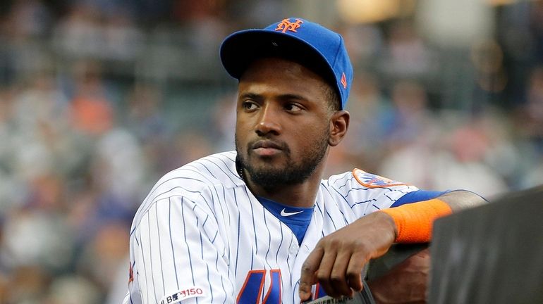 Adeiny Hechavarria #11 of the Mets looks on during the...