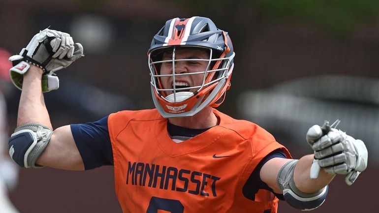 Cal Girard #9 of Manhasset reacts after gaining control of...