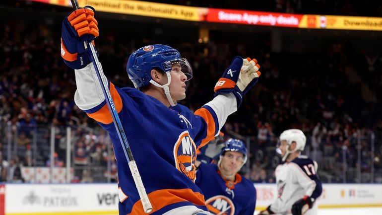 Bo Horvat #14 of the Islanders celebrates his first goal...