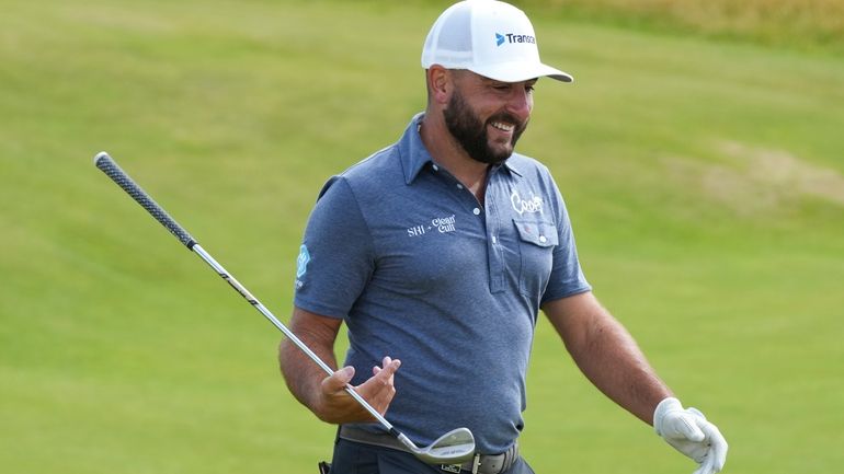 Stephan Jaeger of Germany walks down the 15th fairway during...