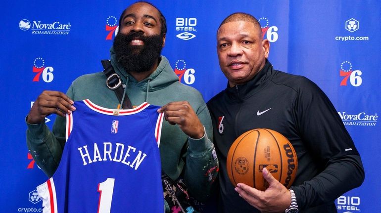 Philadelphia 76ers' James Harden, left, poses with head coach Doc...