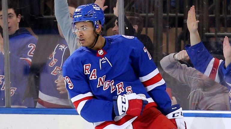 Rangers defenseman K'Andre Miller celebrates his goal against the Red...