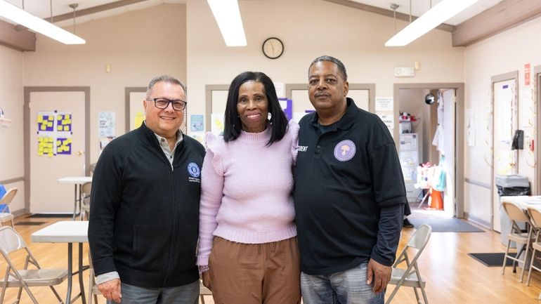 Brookhaven Town Councilman Michael Loguercio, left, with community activist Beverly...