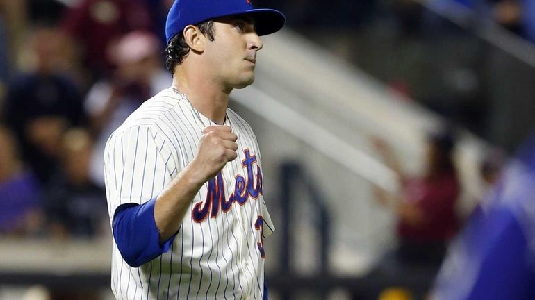 Mets pitcher Matt Harvey celebrates after defeating the Colorado Rockies....