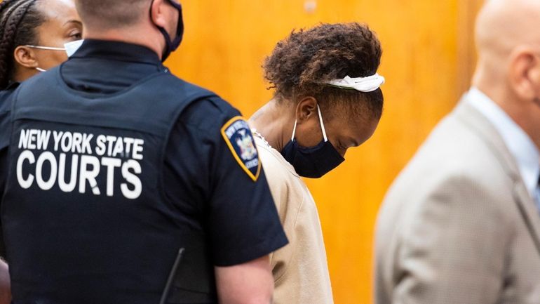 Jessica Beauvais bows her head at her arraignment in May...