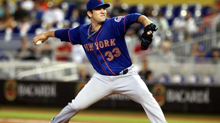 Matt Harvey of the Mets throws against the Miami Marlins...