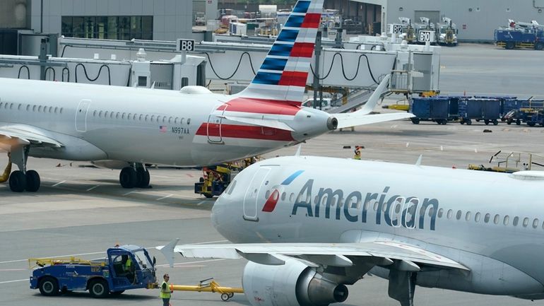 American Airlines passenger jets prepare for departure, July 21, 2021,...