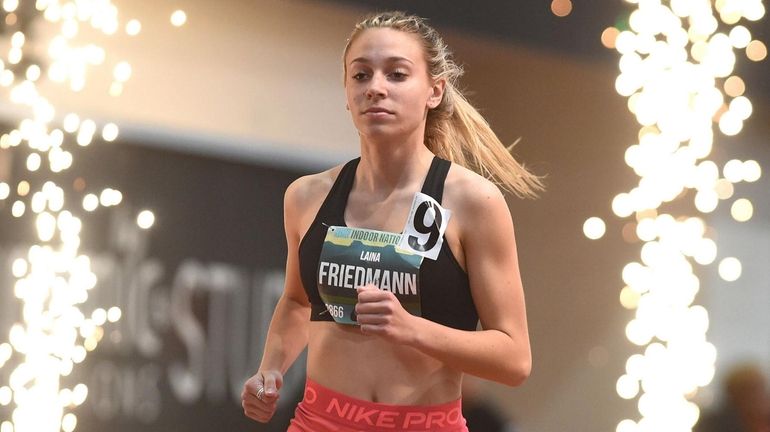 Laina Friedmann of Smithtown West makes her entrance on to...